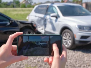 phone screen taking photo evidence of car accident